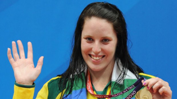 Golden stunner ... Australian swimmer Alicia Coutts poses on the podium.