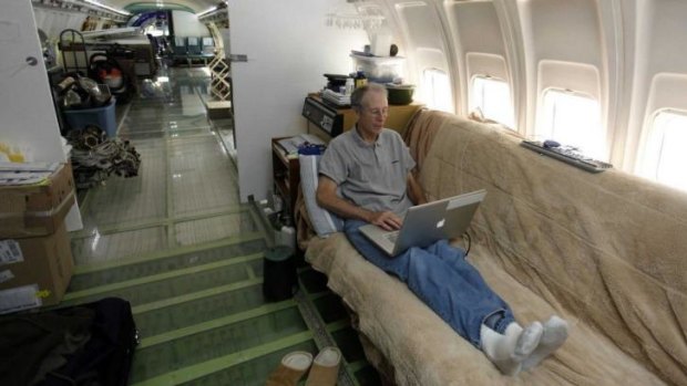 Bruce Campbell relaxing inside his aircraft home.