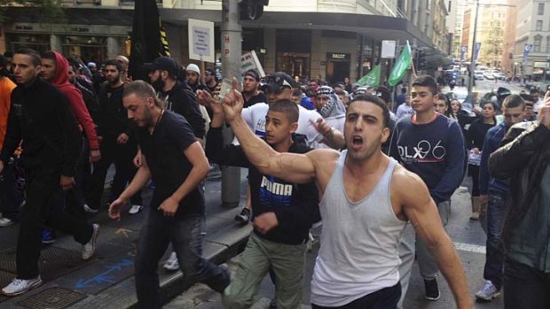 Out of control ... young Muslim protesters head for the US Consulate in Sydney on September 15 last year.