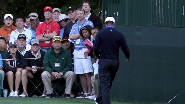 Tiger Woods kicks his club after a wayward shot during his second round of the US Masters.