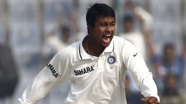 Spinner ... Pragyan Ojha celebrates after  Carlton Baugh's dismissal.