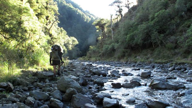A deer hunter make his way up-river in the New Zealand's Ruahine Ranges in March 2013.