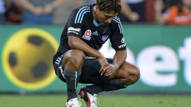 Nick Carle of Sydney appears dejected after losing the round two A-League match against Brisbane Roar.