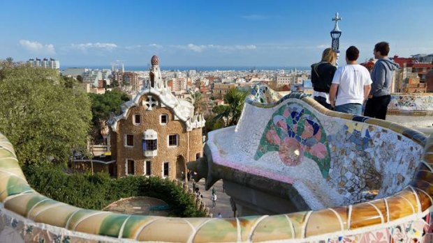 Tourists take in the view in Barcelona, Spain.