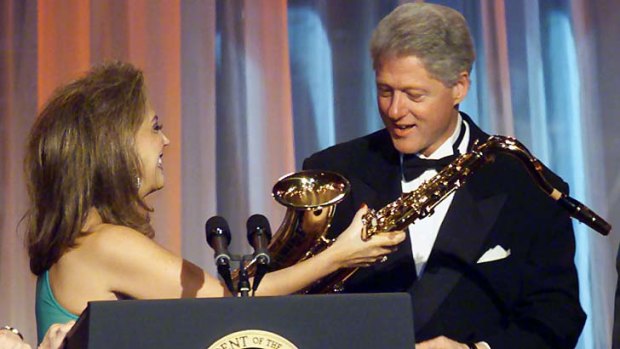Had a word in his ear: Denise Rich presents former US president Bill Clinton with a saxaphone in New York in November 2000.