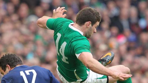 Fergus McFadden of Ireland vies for the ball with Damien Traille.