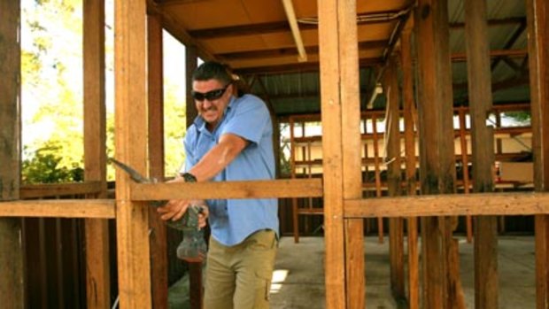Low interest rates behind the pick-up in building work...Greg Pearce works on an extension at the house in Engadine.