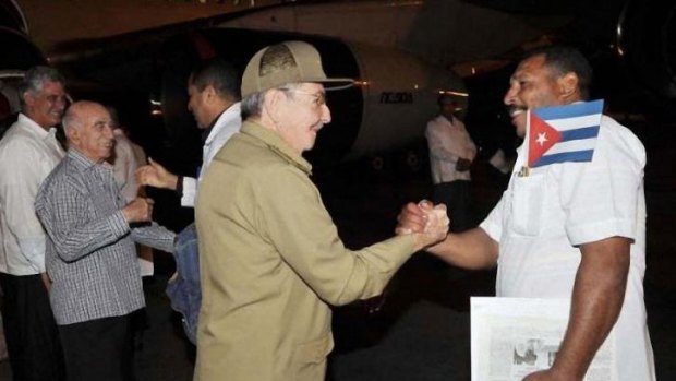 Raul Castro, centre, farewells 35 doctors and 48 nurses as they leave Cuba for Liberia and Guinea to fight the Ebola epidemic.     