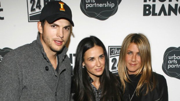 Call me a puma ... Demi Moore, centre, pictured on Monday with husband Ashton Kutcher, left, and Jennifer Aniston at an after party for "The 24 Hour Plays on Broadway".