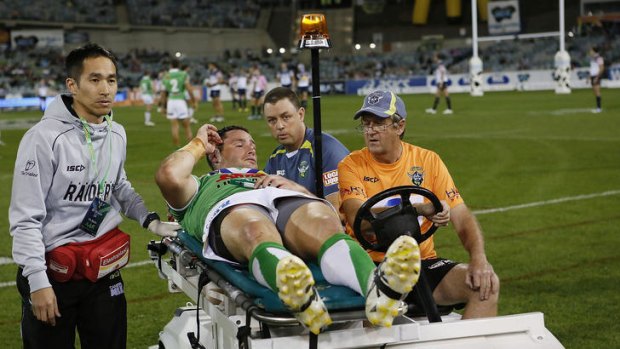 Radiers prop Brett White is taken from the field  after injuring his knee during the round five NRL match between the Canberra Raiders and the North Queensland Cowboys at Canberra Stadium.