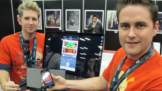 Joseph, left, and Sam Russell, brothers from Melbourne,  show off their Jam smartphone app at the South by Southwest (SXSW) festival in Austin, Texas.