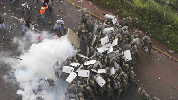 Supporters of ousted Honduras President Manuel Zelaya clash with soldiers.