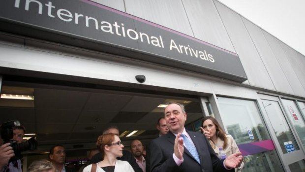 Scottish nationalist leader Alex Salmond campaigns at Edinburgh international airport.