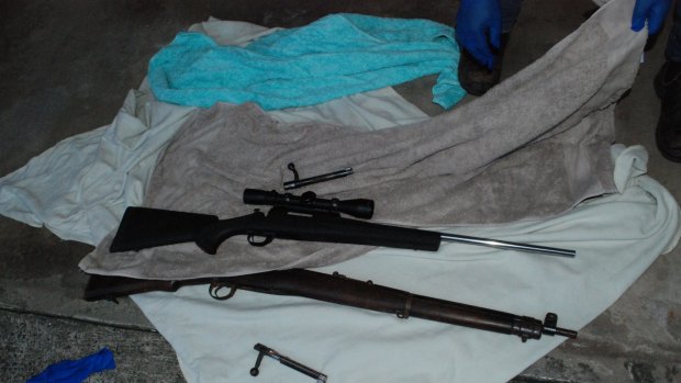 Police uncovered a .303 rifle, a .223 Remington rifle and ammunition during a search at a Gipps St unit in Wollongong following Daniel Tarvij's arrest. He has been charged with firearm offences. 