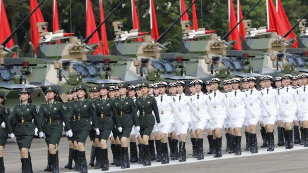Female People's Liberation Army troops march during a visit by Chinese President Xi Jinping at the Shek Kong Barracks in Hong Kong.