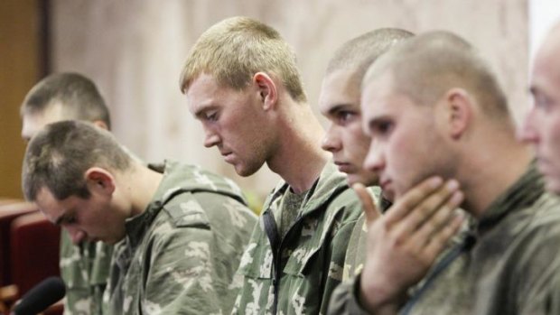A group of Russian servicemen, who are detained by Ukrainian authorities, attend a news conference in Kiev.