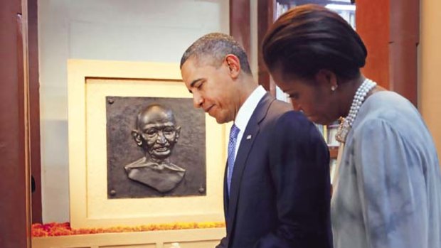 Distinguished visitors... the Obamas at the ManiBhavan Gandhi Museum in Mumbai.
