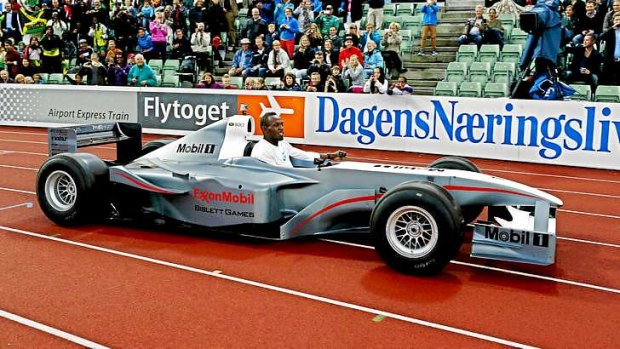 Usain Bolt of Jamacia arrives at the Bislett Stadium in an electric formula one car.