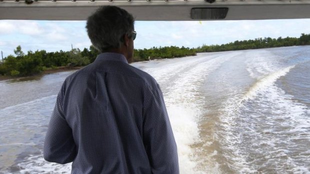 US Secretary of State John Kerry rides a boat through the Mekong River Delta on Sunday.