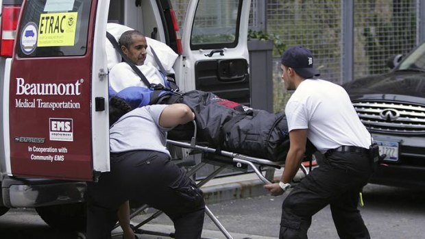 Evacuation ... paramedics wheel a patient out of Bellevue Hospital.