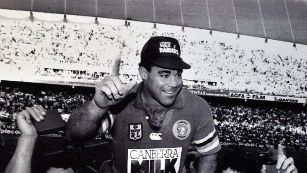 Raiders Laurie Daley and Bradley Clyde chair Mal Meninga after their 1994 grand final win over the Bulldogs.