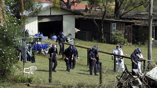 Tragedy &#8230; police scour the property where Inspector Bryson Anderson was fatally stabbed.