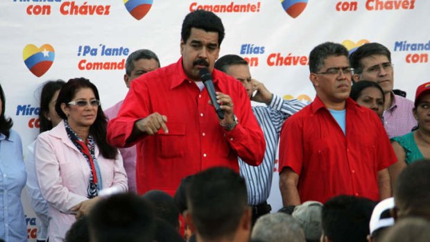 Nicolas Maduro (centre) speaks during a ceremony in the popular area of Petare, Caracas.