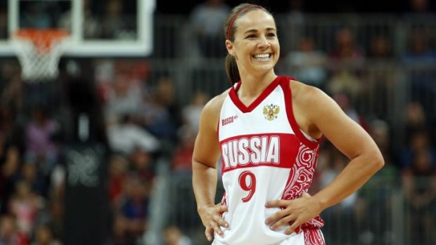 International: Becky Hammon smiles toward her bench during the women's preliminary round Group B basketball match while playing for Russia against Brazil at the London 2012 Olympic Games.