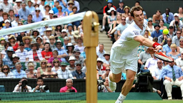 Andy Murray reaches for the ball during his second-round clash with Finland's Jarkko Nieminen, which he won in straight sets.