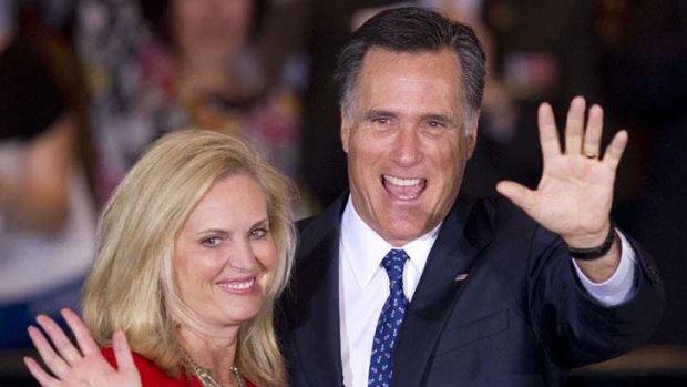 Glad hands ... a more relaxed Mitt Romney and wife, Ann, celebrate victory at the Illinois primary night in Schaumburg.