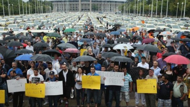 Taxi drivers protest next to the Olympia Stadium in Berlin.