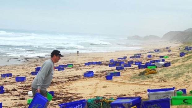 The Portsea back beach yesterday was littered with brightly coloured plastic boxes along the shoreline, washed up from the wrecked fishing trawler.