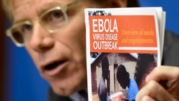 World Health Organization's Assistant Director General Bruce Aylward holds a report on Ebola virus. 