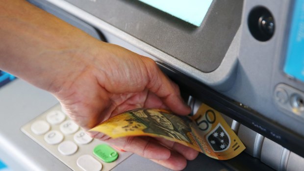 Cash withdrawals from ATMs were down 5.2 per cent in the pre-Christmas rush as credit card spending rose markedly .