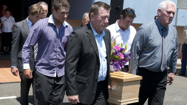 A coffin is walked to a hearse after the Funeral for Noelene and Yvana Bischoff in Gatton Baptist Church.