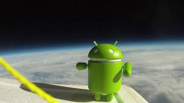 Google's Android mascot looks down on Earth.