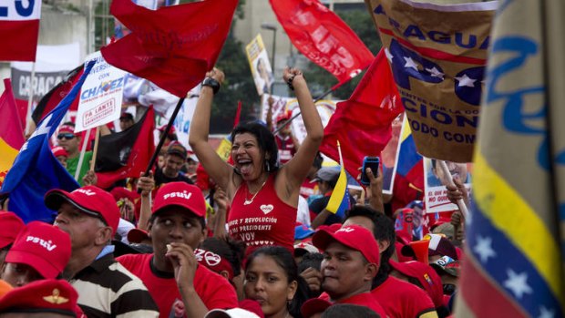 Supporters of Venezuelan President Hugo Chavez attend his closing campaign rally in Caracas.