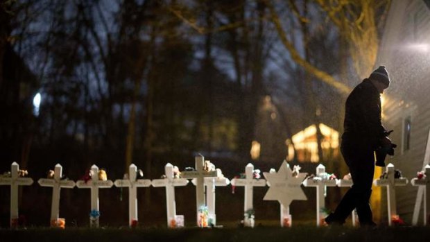 Final goodbyes &#8230; a Newtown man remembers the victims with a memorial in his garden.