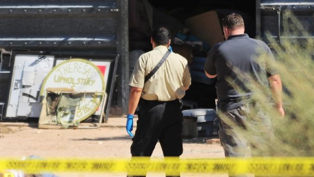 Yuma County detectives investigate the scene of a murder at a residence east of Wellton, Arizona.