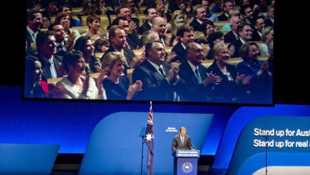 Tony Abbott's Coalition colleagues look on at yesterday's campaign launch.