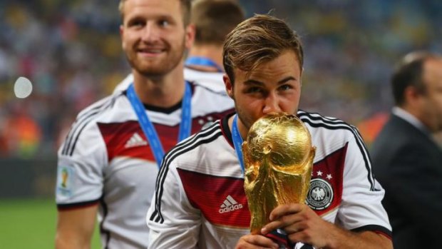 Top of the rankings: Mario Goetze of Germany kisses the World Cup.
