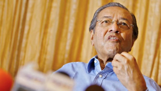 Still outspoken: Former prime minister Mahathir Mohamad talks to journalists at his residence on the outskirts of Kuala Lumpur.