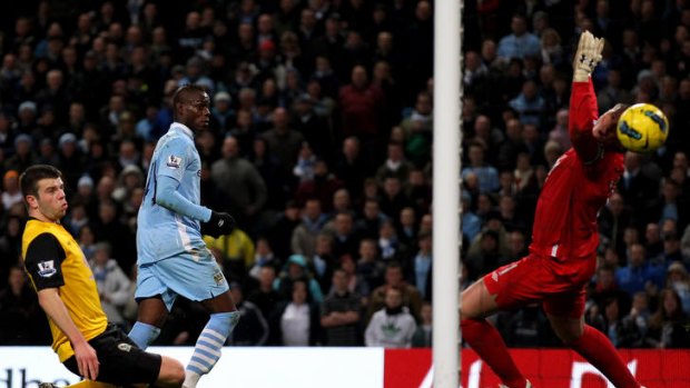 Mario Balotelli of Manchester City scores the opening goal against Blackburn.