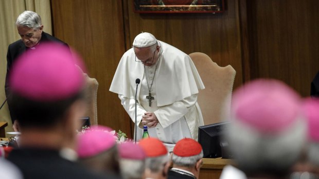 Pope Francis prays during the opening of the second day of a Vatican's conference on church sex abuse.