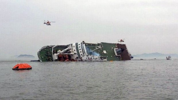 A South Korean passenger ship, with more than 400 passengers on board, is seen listing heavily in the sea off Jindo. One passenger said those on board were in their cabins but  having trouble keeping their balance.