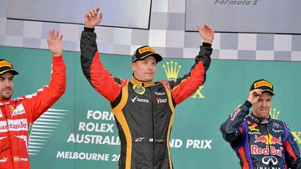Lotus driver Kimi Raikkonen of Finland celebrates victory in the Formula One Australian Grand Prix in Melbourne.