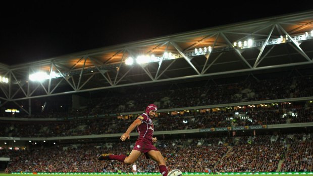 On fire ... Jonathan Thurston kicks for a goal for the Maroons.