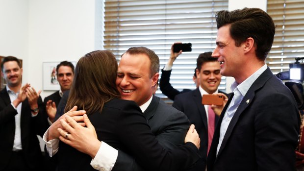 Liberal MPs Kelly O'Dwyer, Tim Wilson and his partner Ryan Bolger celebrate after the result of the same-sex marriage postal survey was announced, during a gathering at Senator Simon Birmingham's office at Parliament House in Canberra on Wednesday 15 November 2017. fedpol sexpol Photo: Alex Ellinghausen