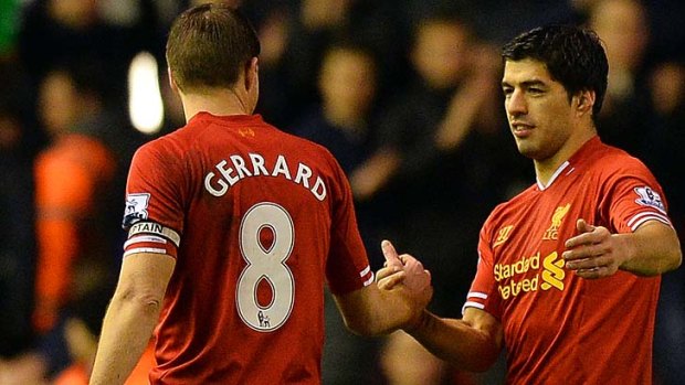 Liverpool's Uruguayan striker Luis Suarez (R) celebrates with English midfielder Steven Gerrard.