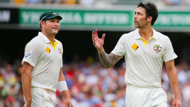 Ryan Harris talks to Mitchell Johnson on day two of the first Test.